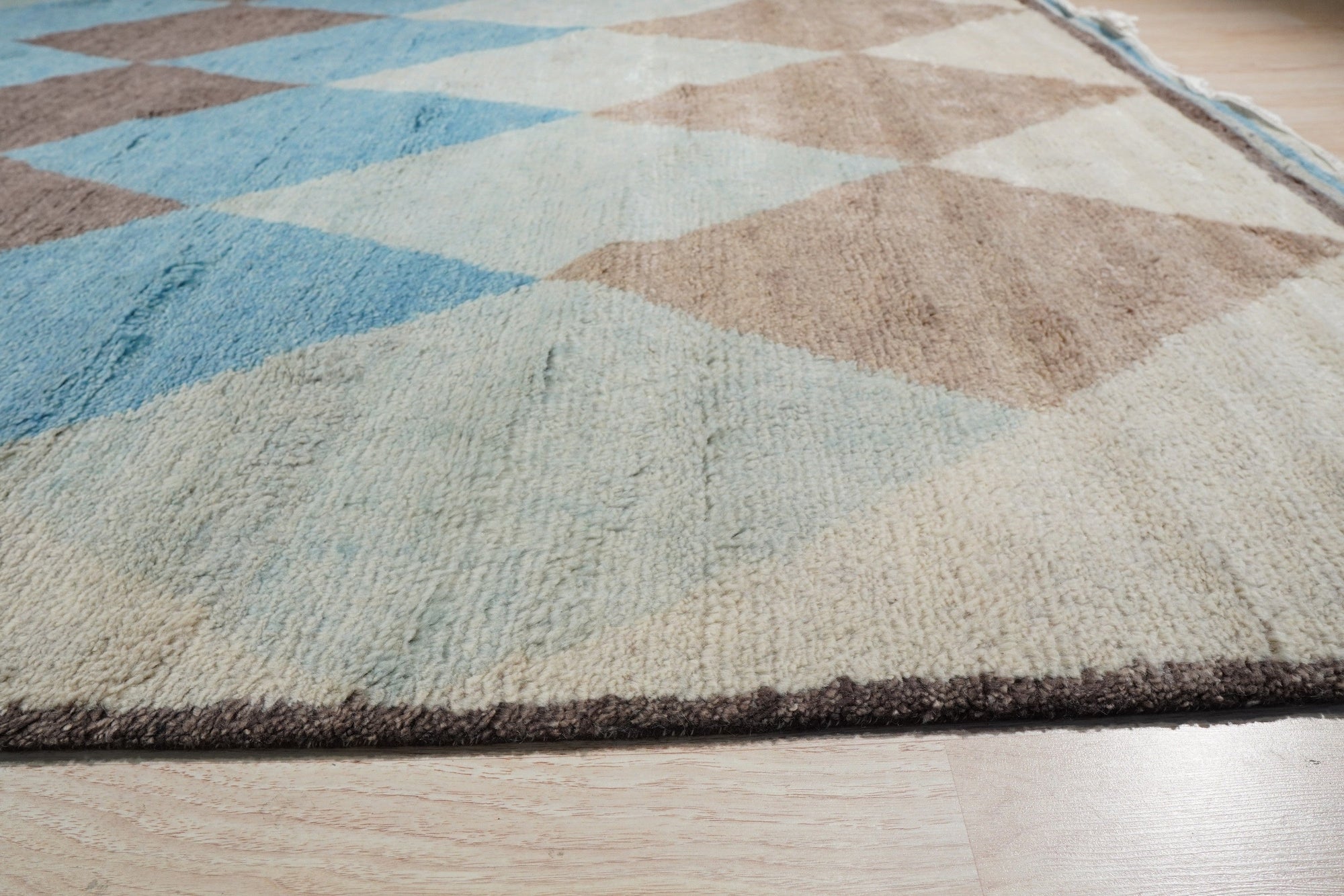 Comfortable Moroccan Multicolor Hand Knotted Wool Rug, vibrant hues dance across this hand-knotted wool rug, showcasing a lively Moroccan design; seen in a room setting, its textures and colors enliven the space.