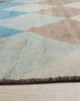 Comfortable Moroccan Multicolor Hand Knotted Wool Rug, vibrant hues dance across this hand-knotted wool rug, showcasing a lively Moroccan design; seen in a room setting, its textures and colors enliven the space.