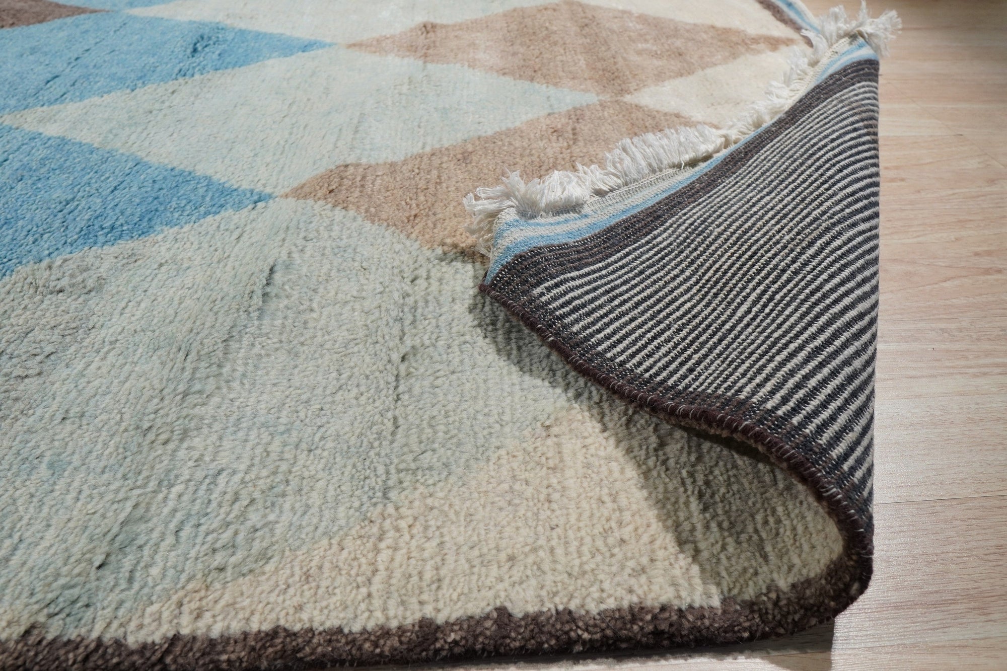 Comfortable Moroccan Multicolor Hand Knotted Wool Rug, vibrant hues and intricate geometric patterns bloom across this wool rug, lending warmth and texture to its surroundings.