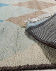 Comfortable Moroccan Multicolor Hand Knotted Wool Rug, vibrant hues and intricate geometric patterns bloom across this wool rug, lending warmth and texture to its surroundings.