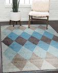 Comfortable Moroccan Multicolor Hand Knotted Wool Rug, vibrant colors pop against a light wood floor, its intricate geometric patterns adding warmth and texture to a modern living space.