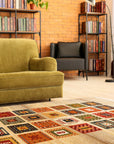Violet Luna Ivory Machine Made Wool Rug lays in a brightly lit living space, its ivory and violet hues complementing the modern decor; the machine-made wool texture adds warmth and subtle pattern to the room.
