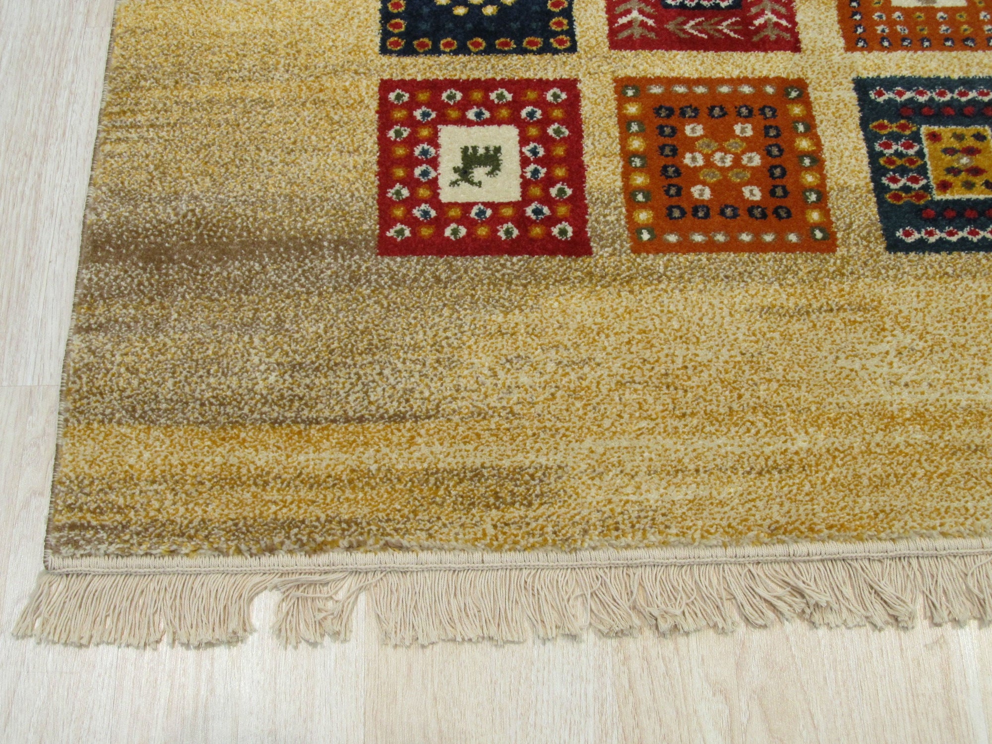 Violet Luna Ivory Machine Made Wool Rug, showcasing a soft, ivory field overlaid with a delicate, vine-like pattern in muted violet and cream tones; the machine-made wool construction providing a textural depth.