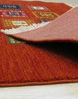 Classic Artisan Red Machine Made Wool Rug: Crimson and ivory geometric patterns dance across this machine-made wool rug, filling a brightly lit room with warmth and texture.