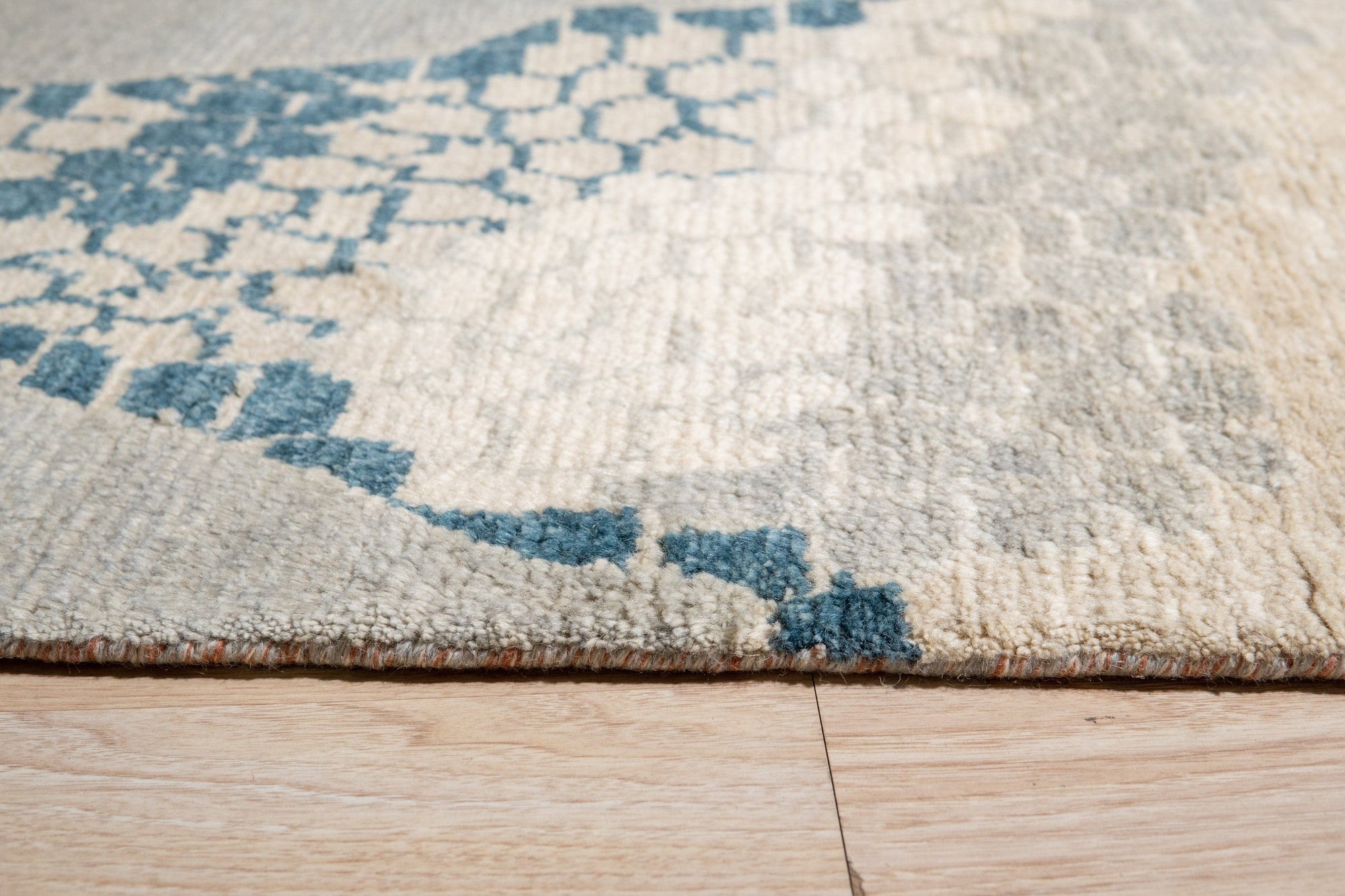 Comfortable Moroccan Multicolor Hand Knotted Wool Rug, a vibrant wool rug showcasing a traditional Moroccan design with bold reds, blues, yellows, and greens, seen in a bright, minimalist living room setting.