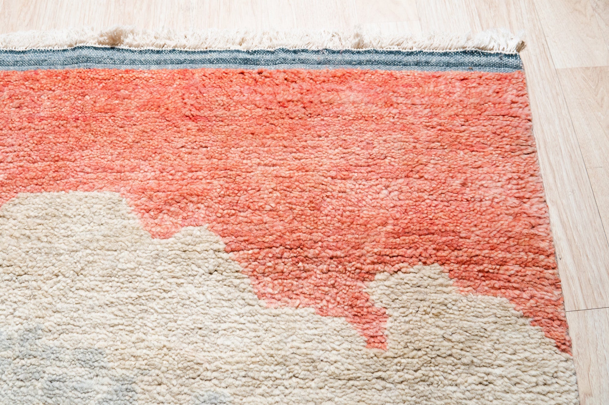 Comfortable Moroccan Multicolor Hand Knotted Wool Rug, vibrant stripes and geometric patterns dance across this hand-knotted wool rug, lending a touch of bohemian warmth to a light and airy space.