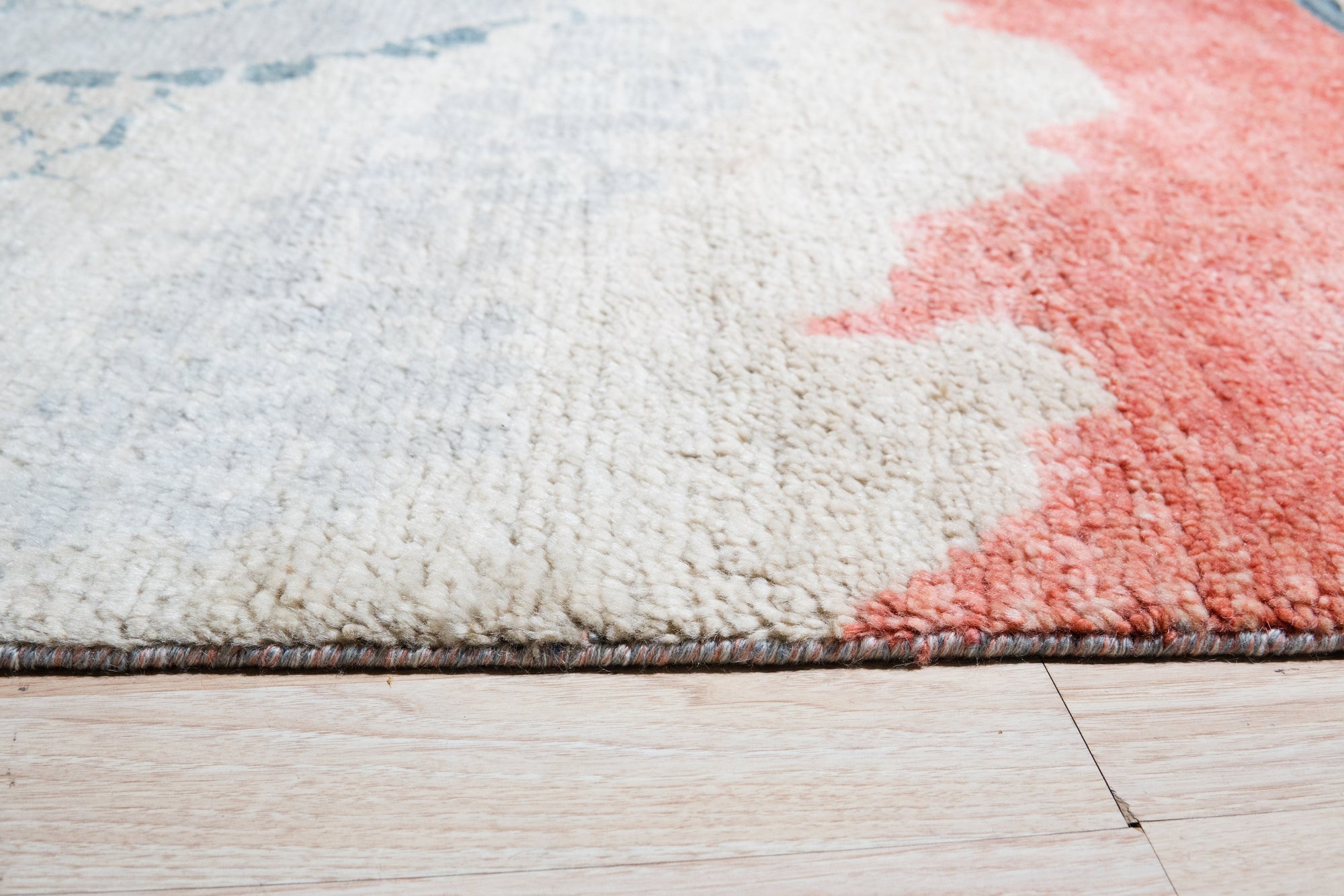 Comfortable Moroccan Multicolor Hand Knotted Wool Rug, a vibrant explosion of color and texture in a detailed close-up showcasing intricate hand-knotted wool craftsmanship.
