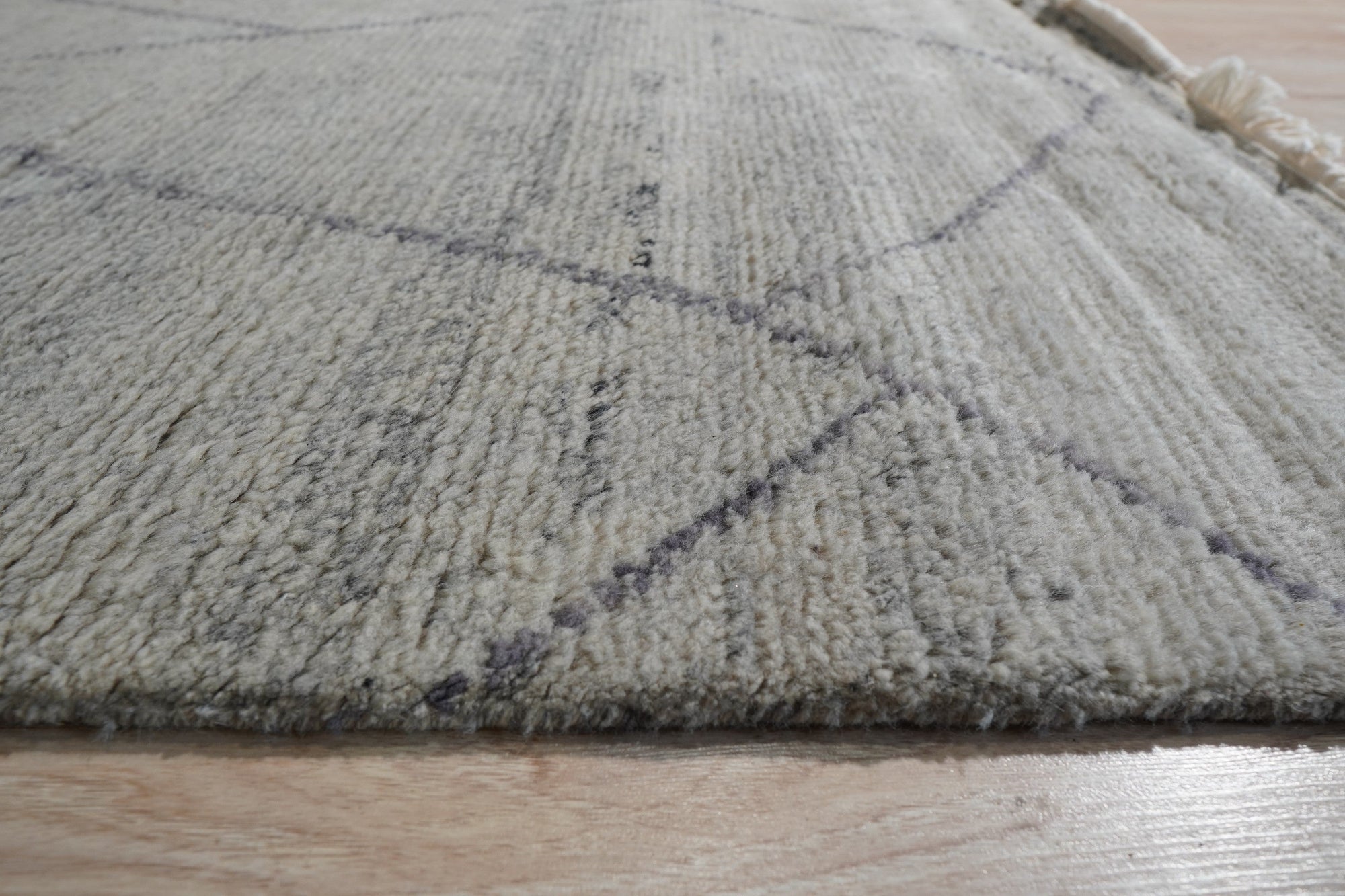 Penelope Diamond Silver Hand Knotted Wool Rug, woven with a subtle diamond pattern in shimmering silver wool, lending a touch of understated elegance to any space.
