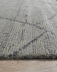 Penelope Diamond Silver Hand Knotted Wool Rug, woven with a subtle diamond pattern in shimmering silver wool, lending a touch of understated elegance to any space.