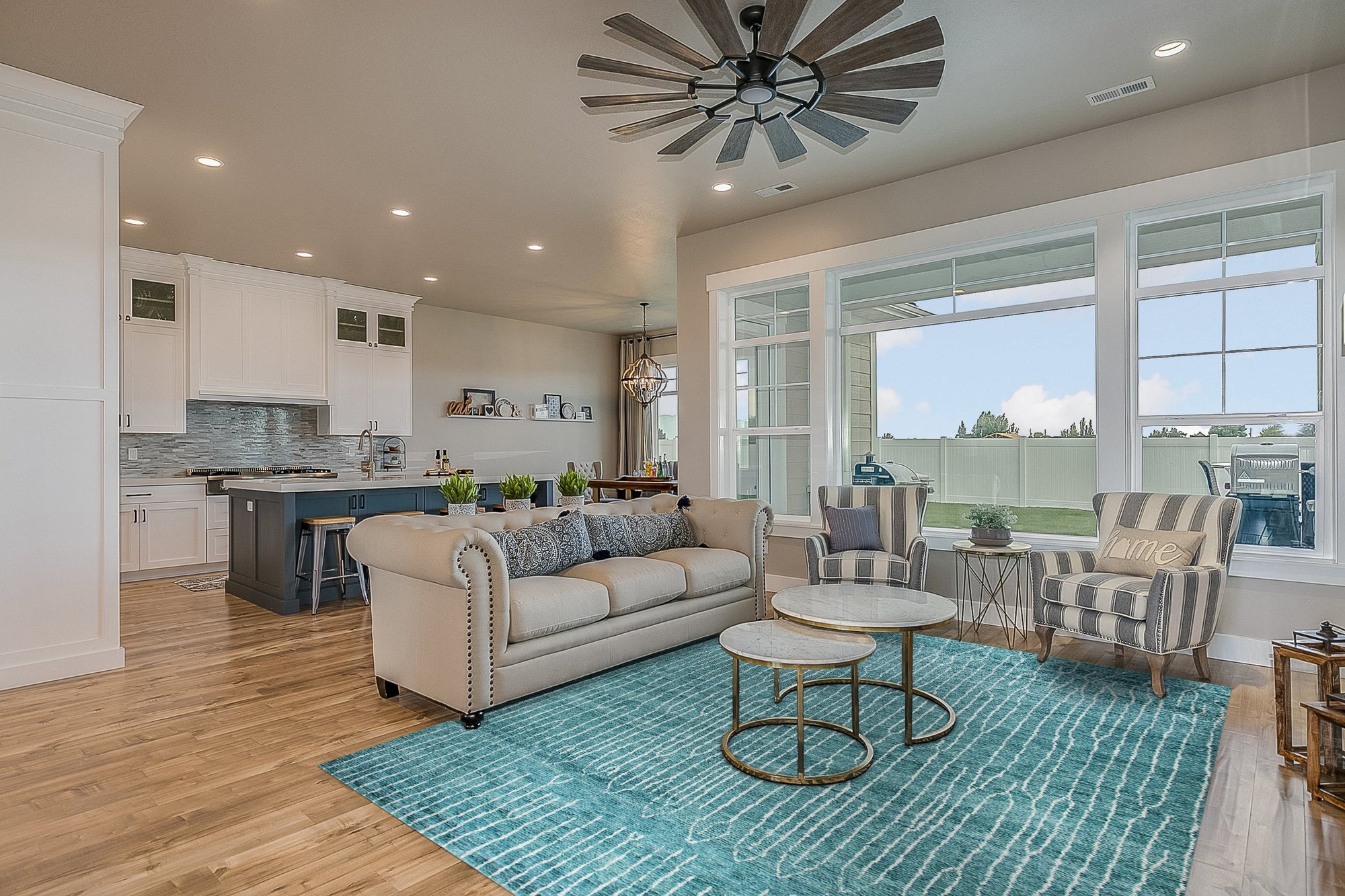 Lush Moroccan Green Hand Knotted Wool Rug gracing a bright, modern living room; intricate geometric patterns rendered in rich shades of green and cream create a focal point anchoring a seating area with a mid-century modern sofa.