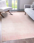 Delicate Moroccan Pink Hand Knotted Wool Rug, its subtle blush tones and intricate geometric patterns lending warmth to a bright, modern living space.