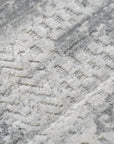 Versatile Freya Gray Handmade Wool Rug, its soft gray tones and subtle, geometric pattern lending a modern yet comforting ambiance to a bright, airy living space.