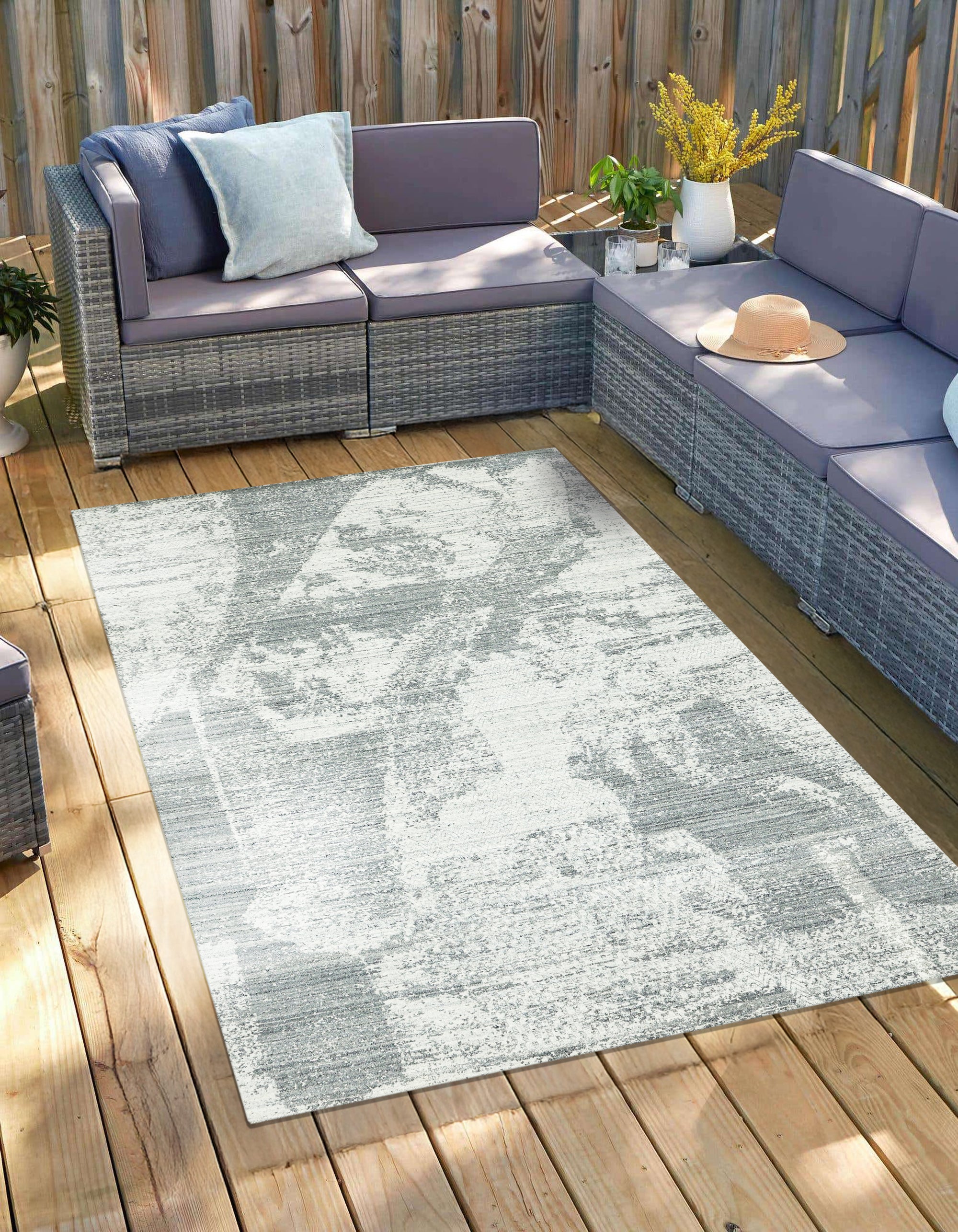 Versatile Freya Gray Handmade Wool Rug, a soft gray wool rug with a subtle geometric pattern, positioned as the fourth option in a product series.