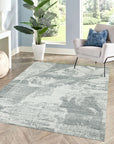 Versatile Freya Gray Handmade Wool Rug, showcasing its textural depth and subtle variations in gray tones, laid on a light wood floor to highlight its versatility and cozy appeal.