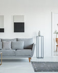 Sleek Inviting Gray Flatweave Rug rests comfortably in a bright living room setting; its flatweave construction adds a touch of understated elegance to the modern space.