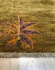 Isla Willow Brown Hand Knotted Wool Rug, featuring a subtle willow-brown palette and hand-knotted texture, anchors a bright living space with a natural, organic feel.