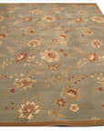 Amara Elegant Blue Machine Made Wool Rug, presenting a calming blue palette and intricate traditional patterns, displayed on a light hardwood floor in a well-lit room.