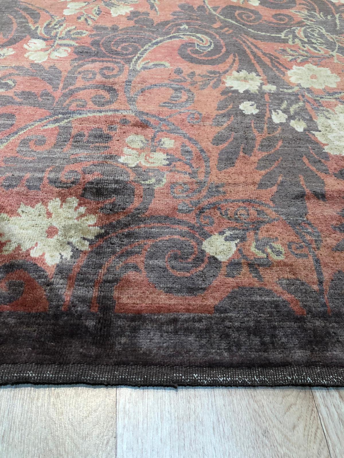 Sarrah Violet Red Hand Knotted Afghan Wool Rug, vibrant reds and deep violets interweave in this hand-knotted wool rug, filling a bright, modern living room with warmth and intricate traditional Afghan patterns.