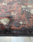 Sarrah Violet Red Hand Knotted Afghan Wool Rug, vibrant reds and deep violets interweave in this hand-knotted wool rug, filling a bright, modern living room with warmth and intricate traditional Afghan patterns.