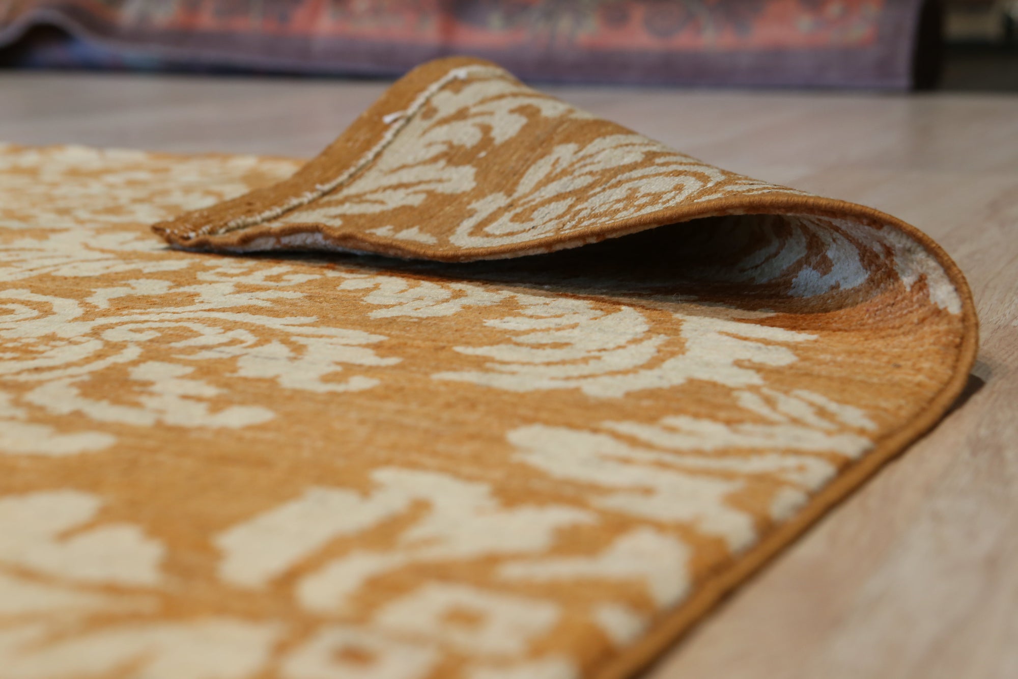Refined Bespoke Brown Hand Knotted Afghan Wool Rug, a warm brown wool rug with intricate hand-knotted details, seen in a styled living room setting.