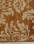 Refined Bespoke Brown Hand Knotted Afghan Wool Rug, a warm brown hand-knotted wool rug with intricate geometric patterns, partially visible showcasing its texture and craftsmanship.