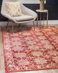 Majestic Artisan Red Hand Knotted Afghan Wool Rug, rich reds and intricate geometric patterns blaze across hand-knotted wool, viewed within a bright, airy living space, adding warmth and texture to the room's decor.