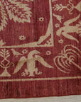 Majestic Artisan Red Hand Knotted Afghan Wool Rug, vibrant red wool covering a living space, showcasing its intricate hand-knotted construction and artisan design.