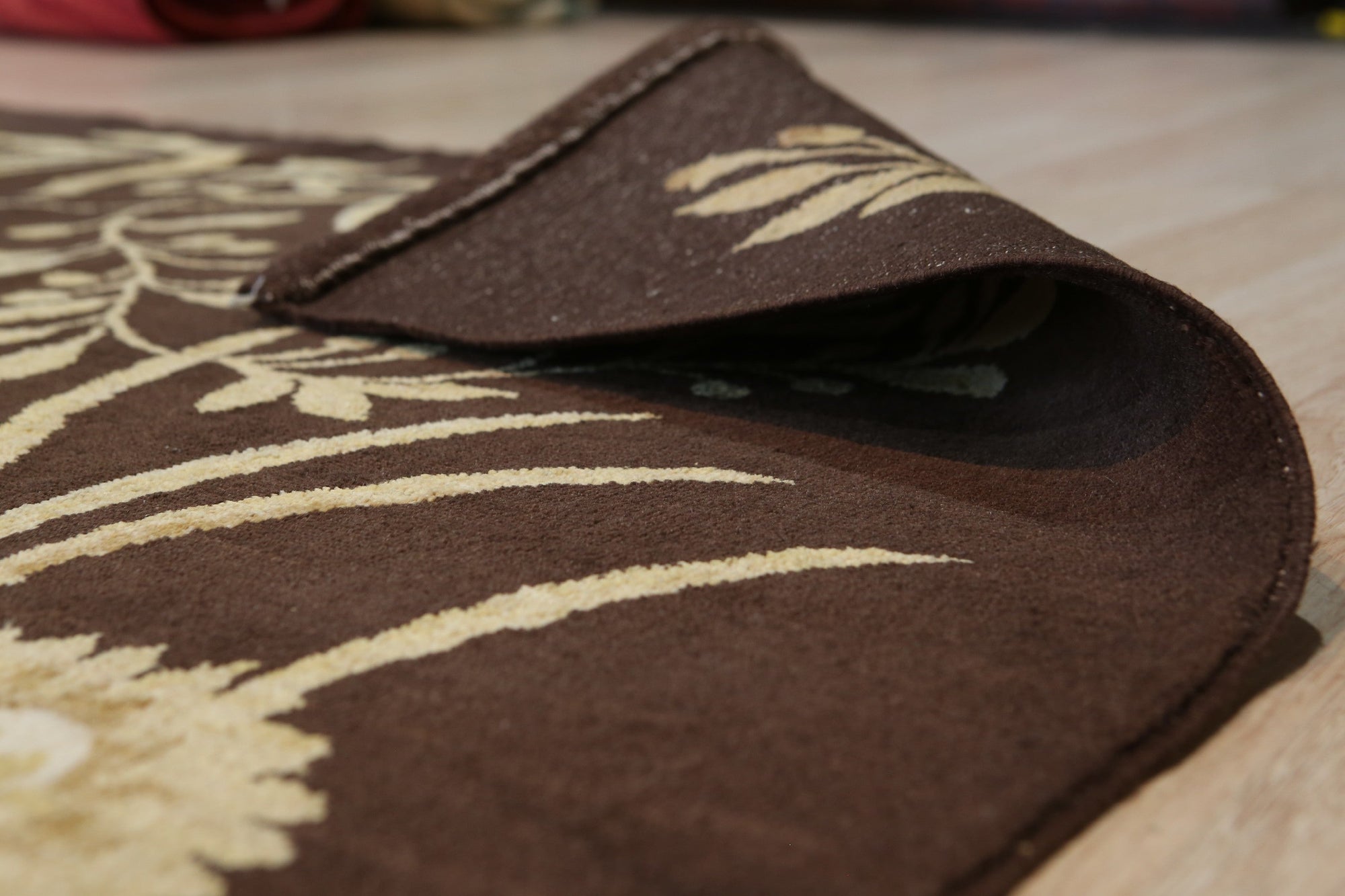 Luxurious Elena Blue Hand Knotted Afghan Wool Rug, showcasing intricate patterns in shades of blue and cream, lying on a light wooden floor.