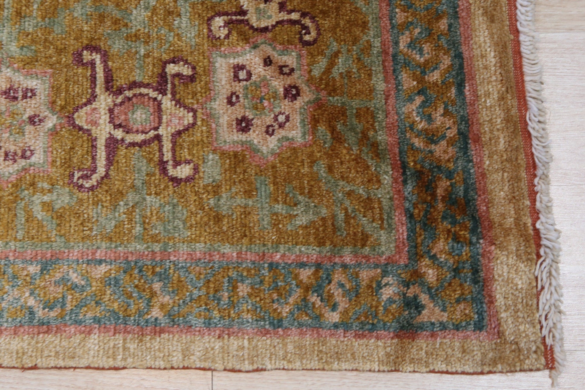 Lush Oushak Green Hand Knotted Rug, its hand-knotted wool pile a soft, verdant expanse, grounding a light-filled living room; subtle, traditional Oushak motifs add understated elegance.