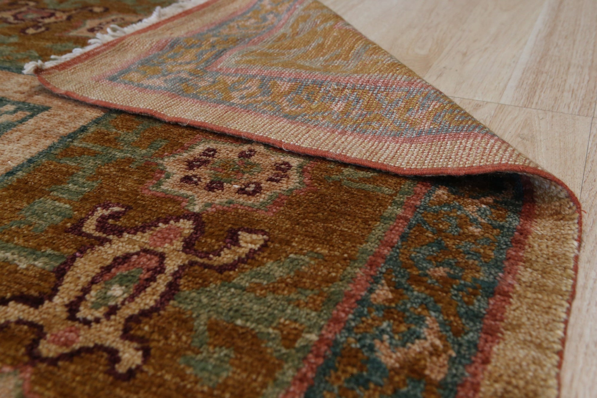 Lush Oushak Green Hand Knotted Rug displayed, showcasing its hand-knotted construction and vibrant green hues. Subtle patterns and texture enrich the rug's surface.