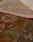 Lush Oushak Green Hand Knotted Rug displayed, showcasing its hand-knotted construction and vibrant green hues. Subtle patterns and texture enrich the rug's surface.