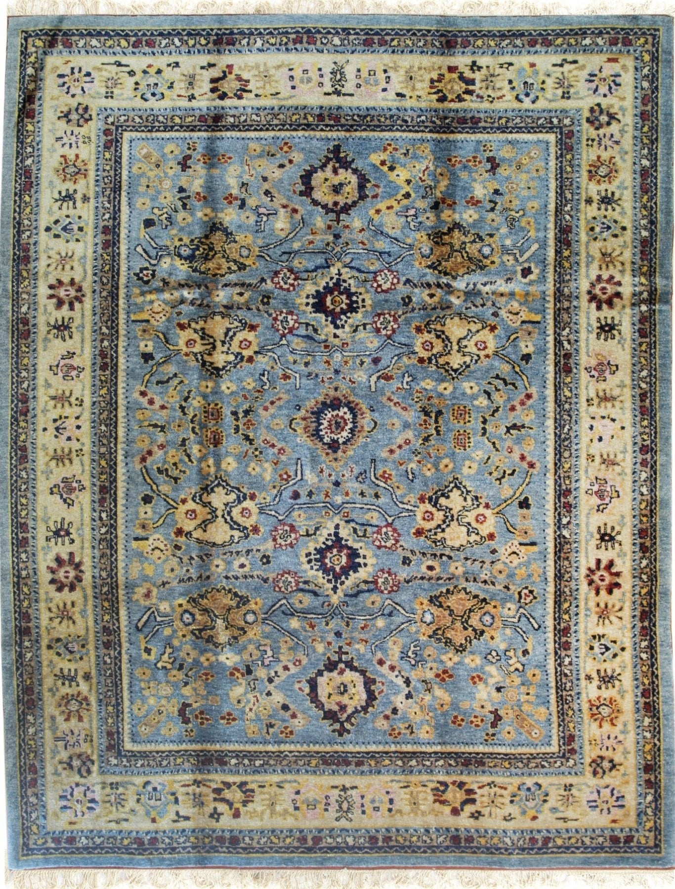 Isolated view displaying Handcrafted Oushak Blue Hand Knotted Rug, highlighting intricate floral medallions and subtle abrash within its plush, textural weave.