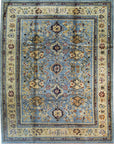 Isolated view displaying Handcrafted Oushak Blue Hand Knotted Rug, highlighting intricate floral medallions and subtle abrash within its plush, textural weave.