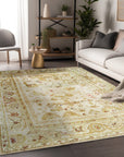Elena Oushak Beige Hand Knotted Rug, its warm beige tones and intricate Oushak patterns grounding a bright living space with a neutral sofa and a touch of greenery.