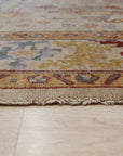 Jade Oushak Beige Hand Knotted Rug, a plush beige rug with intricate floral motifs and a soft, inviting texture, displayed as part of a larger room setting.