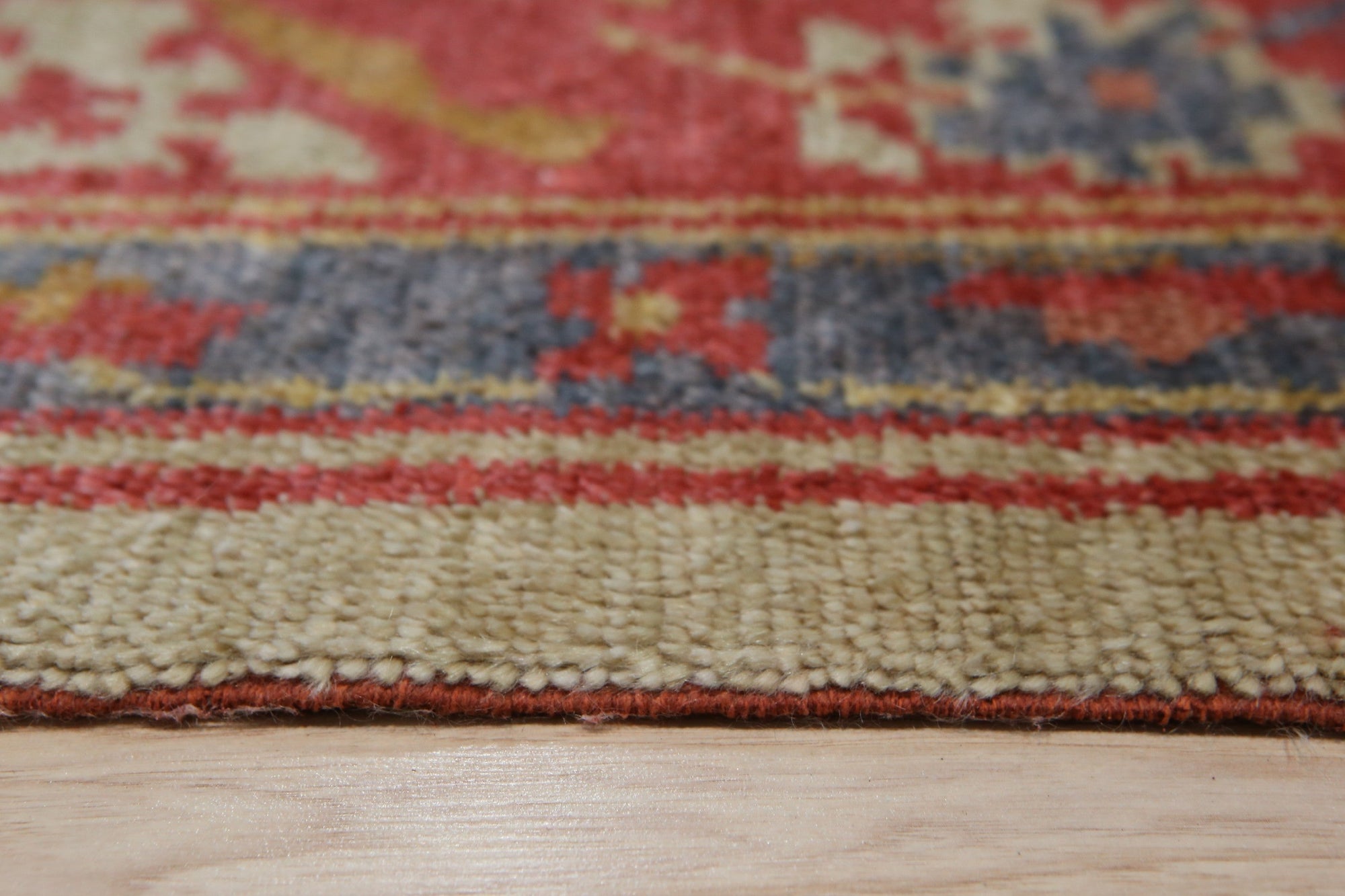Selene Oushak Red Hand Knotted Rug, a rich red and cream wool rug with an intricate traditional Oushak design, showcased in a living room setting.
