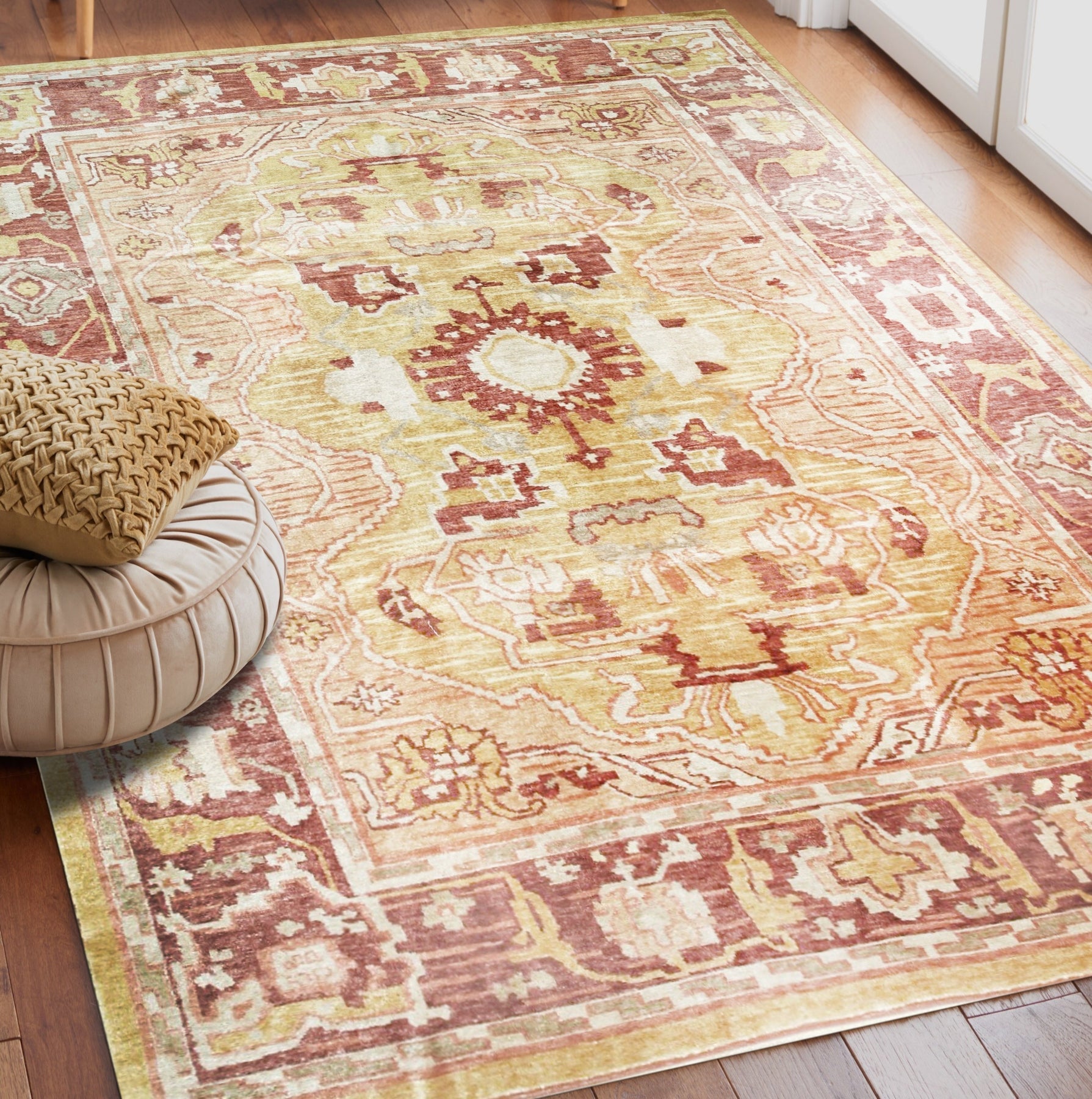 Beautiful Oushak Gold Hand Knotted Rug displayed on a polished hardwood floor, its intricate gold patterns radiating warmth throughout the sunlit room.