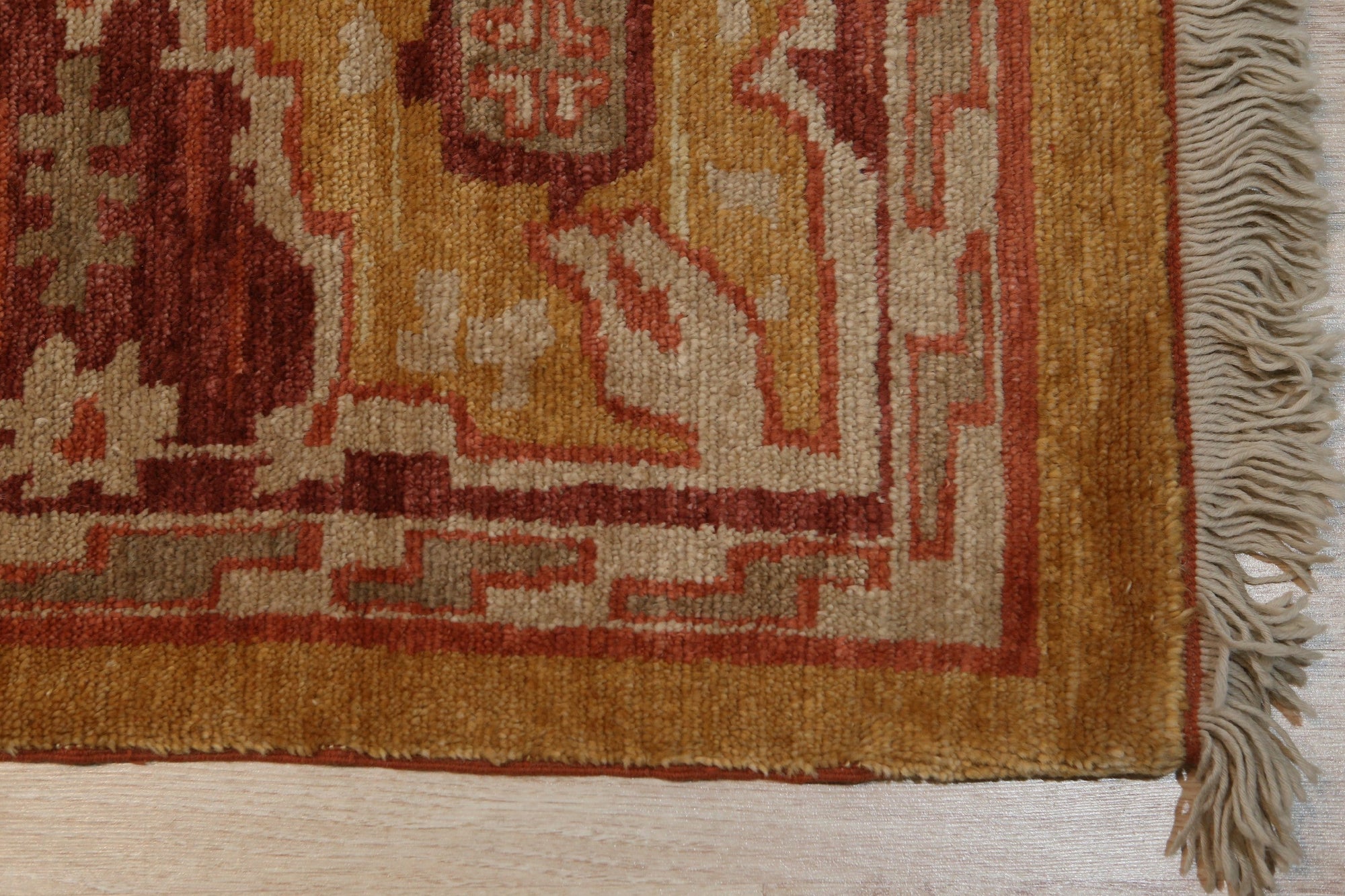 Beautiful Oushak Gold Hand Knotted Rug, warm gold tones and intricate floral patterns unfurl across a hand-knotted wool pile, grounding a softly lit living space.
