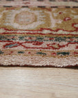 Delicate Oushak Beige Hand Knotted Rug, its subtle beige tones and hand-knotted construction adding warmth to a sun-drenched living space.