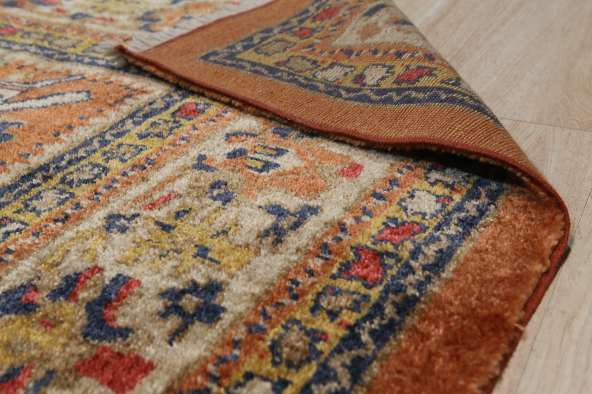Maya Oushak Brown Hand Knotted Rug, warm brown tones and intricate floral patterns create inviting texture underfoot. Hand-knotted construction highlights the rug's detailed craftsmanship and subtle variations.