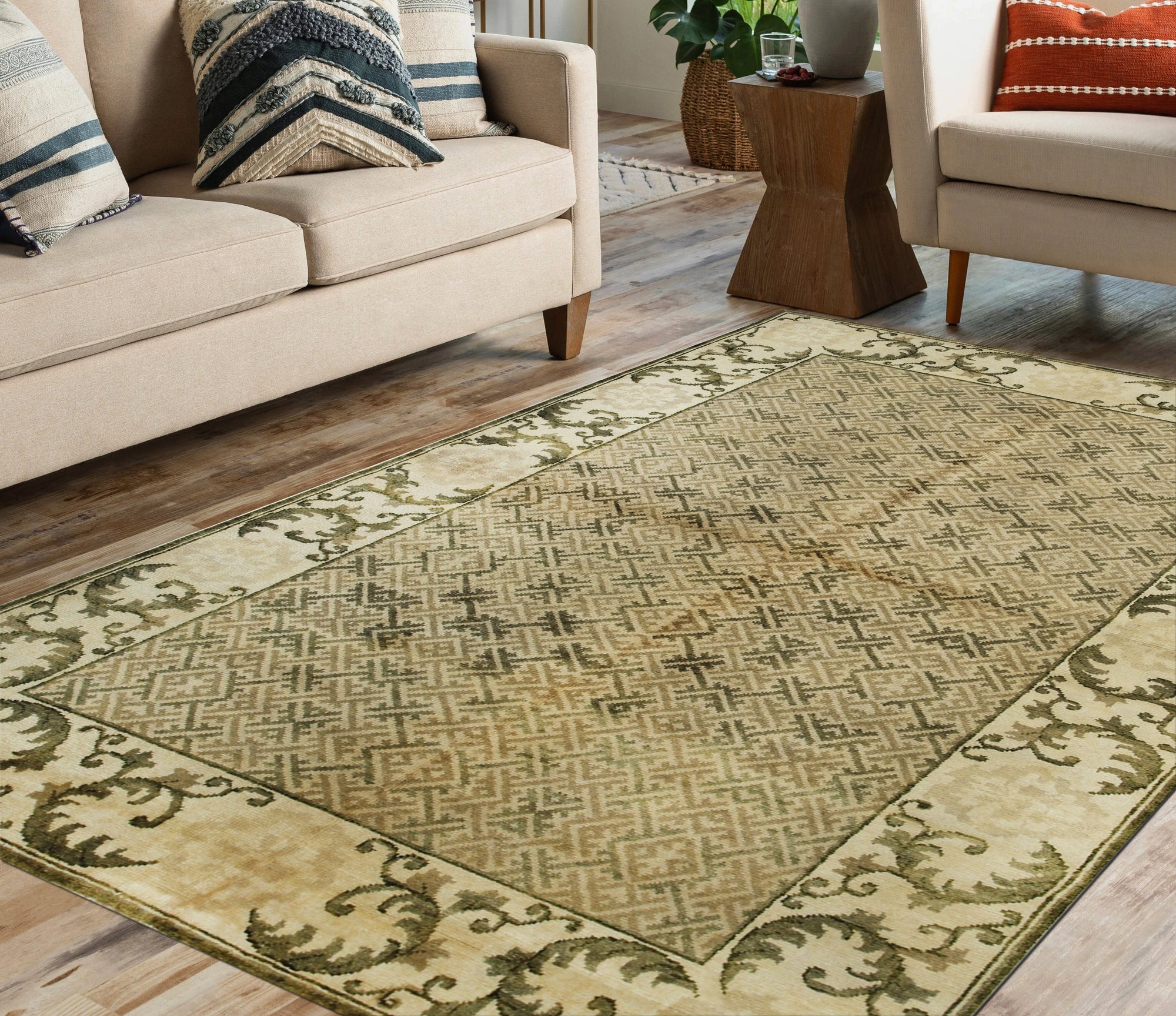 Classic Elena Green Hand Knotted Wool Rug, a lush emerald and ivory wool rug with a traditional, ornate pattern, displayed in a bright, modern living room setting.