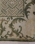 Classic Elena Green Hand Knotted Wool Rug, lush green wool rug with a traditional, intricate pattern, draped beautifully, suggesting a sense of luxury and warmth.