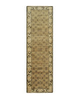 Classic Elena Green Hand Knotted Wool Rug, with its verdant hues and intricate pattern, anchoring a living room with warm wood tones and natural light.