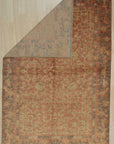 Lydia Jasmine Red Hand Knotted Wool Rug, showcasing intricate floral patterns in rich reds and earthy tones, adds warmth and elegance to a neutral room setting.