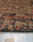 Lydia Jasmine Red Hand Knotted Wool Rug, vibrant reds and subtle creams interweave in a hand-knotted wool texture, showcasing intricate floral designs.