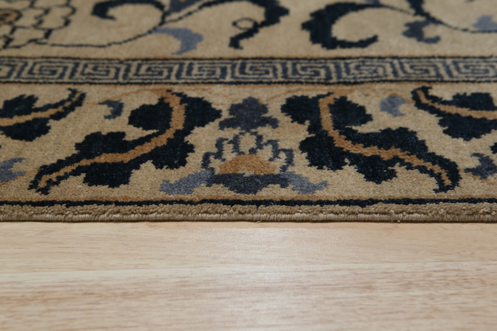 Willow Lydia Gold Hand Knotted Wool Rug, a luxurious gold wool rug hand-knotted with intricate patterns, adding warmth and sophistication to a living space.