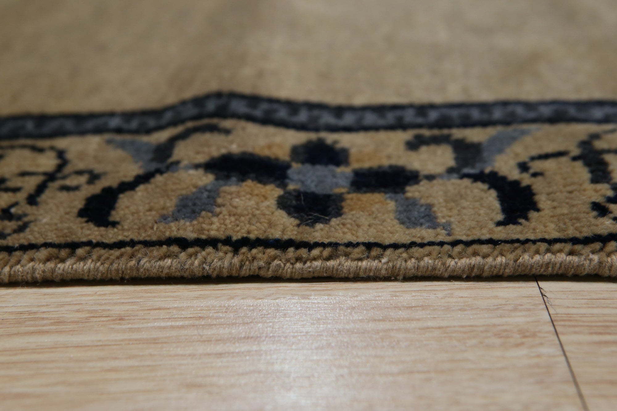 Lila Timeless Beige Hand Knotted Wool Rug, a soft beige wool rug with subtle, hand-knotted detailing, anchoring a light and airy living space.