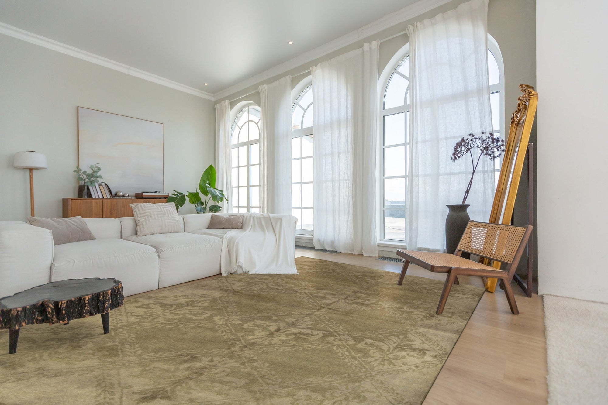 Para Bespoke Beige Hand Knotted Wool Rug, a creamy, subtly patterned textile anchoring a modern living space with neutral tones and natural light, showcasing its plush hand-knotted construction.