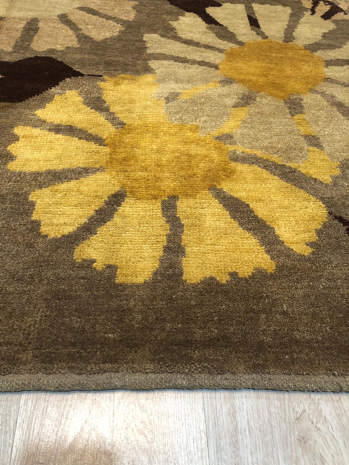 Serene Timeless Brown Hand Knotted Wool Rug gracing a light-filled space, its intricate hand-knotted texture and warm brown tones creating a sophisticated and inviting atmosphere.
