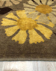 Serene Timeless Brown Hand Knotted Wool Rug gracing a light-filled space, its intricate hand-knotted texture and warm brown tones creating a sophisticated and inviting atmosphere.